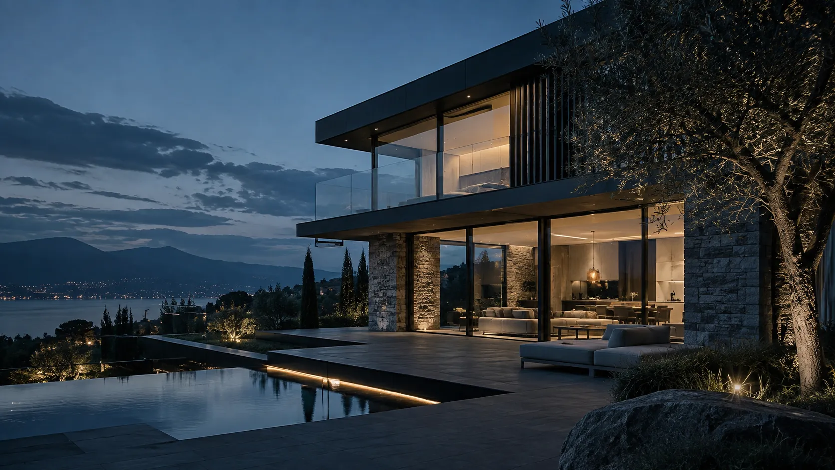 Modern villa at dusk with a warmly lit interior
